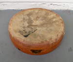 A kanjira frame drum with a punctured skin.