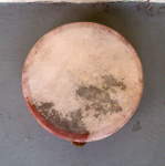A new goat skin drum head on a kanjira frame drum.