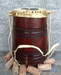 A tabla with chewed up pudi and strap.