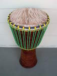 African Djembe hand drum that's gotten a new drum head and rope.