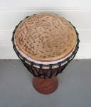 Djembe hand drum with a cow skin that's slipping.