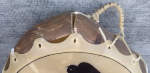 Closeup of collapsed frame and broken lace of drum.