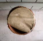 Ripped drum head on a djembe.