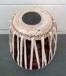 Tabla dayan with ripped drumhead.