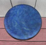 A blue goat skin mounted on a ceramic doumbek.